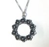 N.E.From silver floral pendant + chain